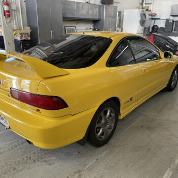 Yellow car in repair shop