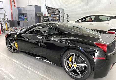 Black sports car dent repair